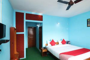 OYO 27772 Hotel Kalawati Retreat客房内的一张或多张床位