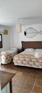 Hotel Camboa Antonina - PR客房内的一张或多张床位
