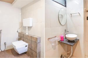 浦那FabExpress Gargi Executive的一间带卫生间、水槽和镜子的浴室