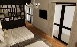 科伦坡TeaTalk的客厅配有白色沙发和吊灯。