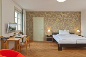 Boutique-Hotel Auberge Langenthal客房内的一张或多张床位