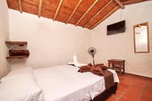 Hotel Terrazas de la Candelaria客房内的一张或多张床位