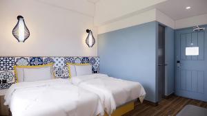 Kampi Hotel Legian客房内的一张或多张床位