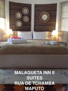 Guesthouse MALAGUETA INN II客房内的一张或多张床位