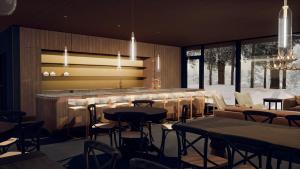 列维Levi OloResort的一间带桌椅的餐厅和一间酒吧