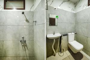 蒂鲁帕蒂FabExpress 7 Hills Home Stay的浴室配有卫生间、盥洗盆和淋浴。