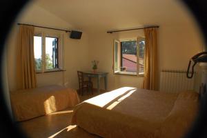 La Rossola Resort & Natura客房内的一张或多张床位