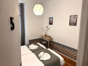 262 Baixa Guesthouse客房内的一张或多张床位