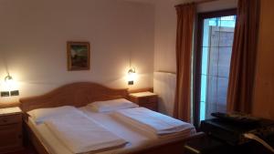 Hotel Garnì Gardena - Appartments客房内的一张或多张床位
