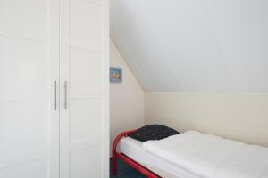 Hello Zeeland - Vakantiehuis Stern 228客房内的一张或多张床位