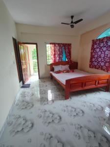 mayapurRadha Gopikanta Guest House - a family Homestay near Iskcon Mayapur的卧室配有一张床