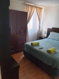 Departamento en Iquique A pasos de playa Cavancha客房内的一张或多张床位