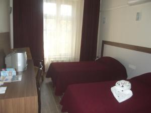 塞尔丘克乌古拉马奥特里酒店客房内的一张或多张床位