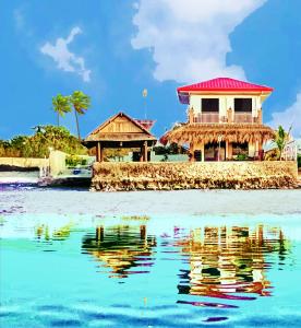 Lapu Lapu CityPRIVATE COLLECTION 贅沢 Jade's Beach Villa 별장 Cebu-Olango An exclusive private beach secret的水中小岛上的房子