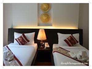 โรงแรม ดิ โอวาเล่ย์ [The O Valley Boutique Hotel]客房内的一张或多张床位