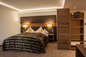 普拉波斯塔加尼酒店客房内的一张或多张床位