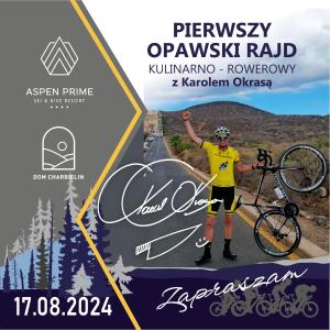 格武霍瓦济Aspen Prime Ski & Bike Resort - basen, sauna, jacuzzi, siłownia w cenie pobytu的站在自行车旁的一个人在路上