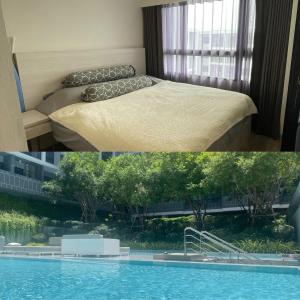 华欣DusitD2 Hua Hin 2- One bedroom with a beautiful view 8的酒店客房带床和游泳池