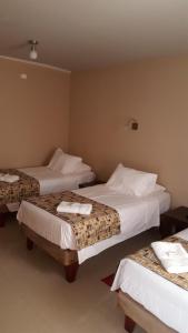 Amaru Hotel客房内的一张或多张床位