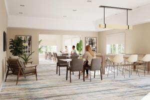 坦帕Residence Inn Tampa Westshore Airport的一个带桌椅的用餐室