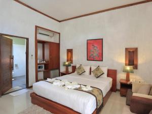 Good Heart Resort Gili Trawangan客房内的一张或多张床位