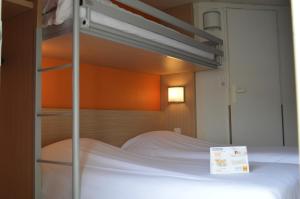 贡比涅 - 亚克斯普瑞米尔经典酒店客房内的一张或多张床位