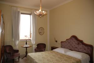Residenza Savonarola Luxury Apartment客房内的一张或多张床位