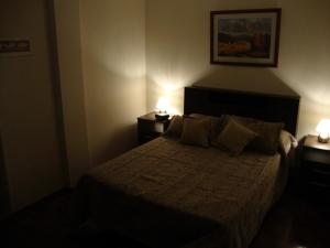 Departamento Maipu Cordoba客房内的一张或多张床位