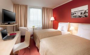 奧洛穆克克拉丽奥国会酒店客房内的一张或多张床位