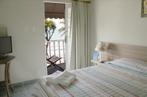 Sol Nascente Hotel Pousada Beira Mar客房内的一张或多张床位