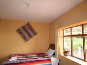 Titicaca Chaska Wasi Amantani客房内的一张或多张床位