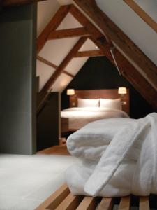 Texel Suites客房内的一张或多张床位