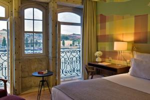 波尔图世界遗产佩斯塔纳复古酒店客房内的一张或多张床位