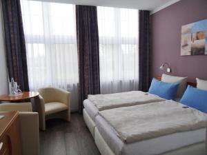 Landhotel Alte Schule - Hotel Garni客房内的一张或多张床位