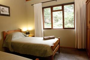 哈雷恩皇家国家公园山林小屋客房内的一张或多张床位