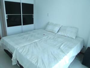 Apartamento Hélio Gregório Barra da Tijuca客房内的一张或多张床位