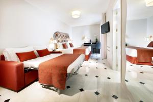 欧洲之星征服者酒店客房内的一张或多张床位