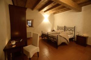 Monastero Di Sant'Erasmo客房内的一张或多张床位