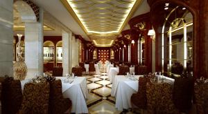 广州粤大金融城国际酒店的大楼内一家带白色桌椅的餐厅