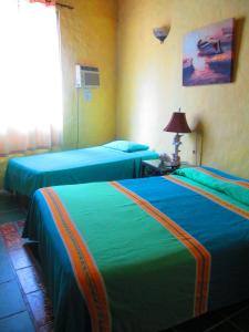 维尔达热带风情酒店客房内的一张或多张床位