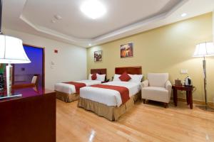 亚洲酒店 - 法拉盛客房内的一张或多张床位