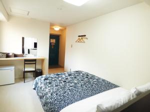 京都丽日旅馆客房内的一张或多张床位