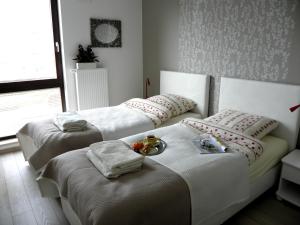 Novum Arkadia Apartamenty客房内的一张或多张床位