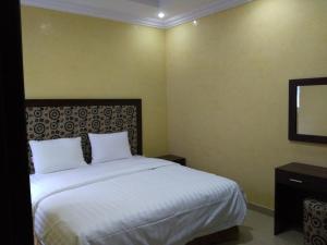Al Makan Hotel by Al Azmy客房内的一张或多张床位