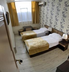 Estet Hotel客房内的一张或多张床位