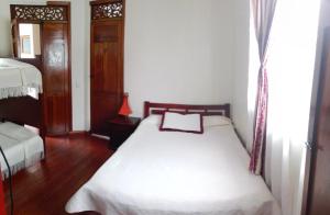 Hotel Alcayata Colonial客房内的一张或多张床位