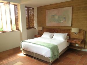 Hotel Alto Del Viento客房内的一张或多张床位