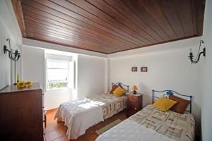 Casas do Capelo客房内的一张或多张床位