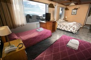 Hotel Aspen Ski客房内的一张或多张床位