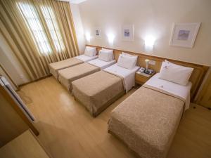 Hotel Regina Rio de Janeiro客房内的一张或多张床位